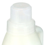 Close-up of a white plastic screw cap and neck of a liquid detergent bottle
