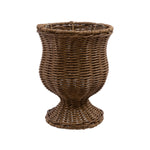 Brown woven goblet-shaped urn planter with pedestal base on white background