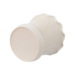 My Texas House cream ceramic planter lying on its side showing bottom and textured exterior