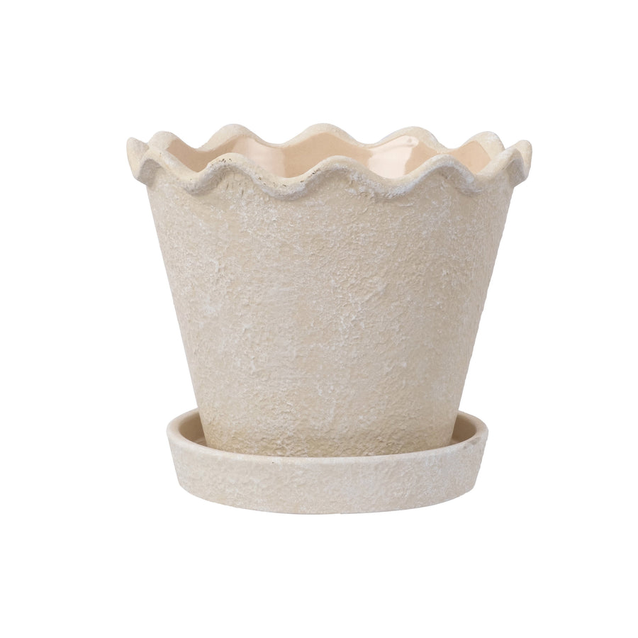 My Texas House cream ceramic planter with wavy rim and matching saucer on white background