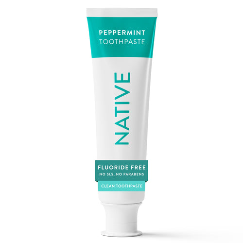 Close-up product shot of a Native peppermint toothpaste tube with teal accents on white background