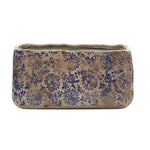 Rectangular blue-and-tan Tuscan ceramic planter with speckled floral pattern on white background