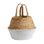Woven jute basket with white rope-wrapped base and upright braided handles against white