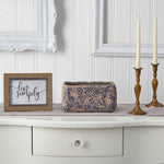 Styled scene showing a rectangular blue-and-tan Tuscan ceramic planter on a console table with decor accents
