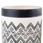 Close-up detail of a Nikos ceramic planter showing black rim and zigzag floral pattern on white ceramic surface.