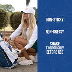 Woman kneeling by a golf bag placing a No Natz bottle with text calling out non-sticky, non-greasy and shake directions