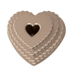 Stacked scalloped heart-shaped bundt pan in metallic bronze with center heart tube, top view