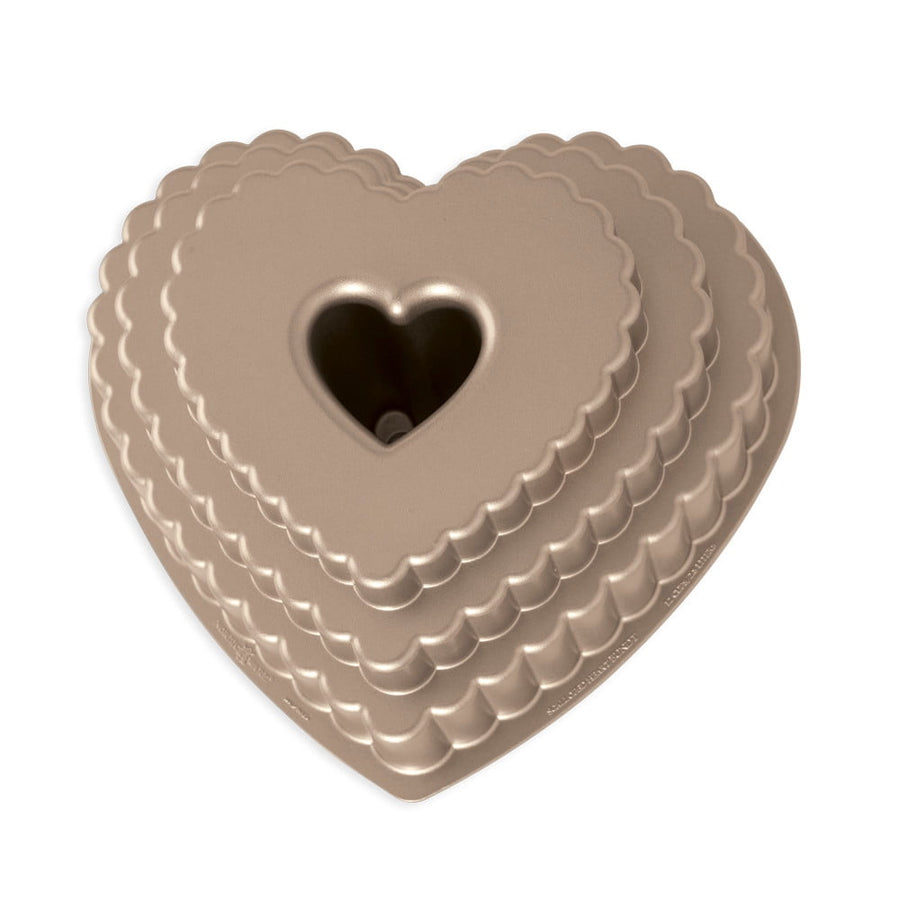 Stacked scalloped heart-shaped bundt pan in metallic bronze with center heart tube, top view