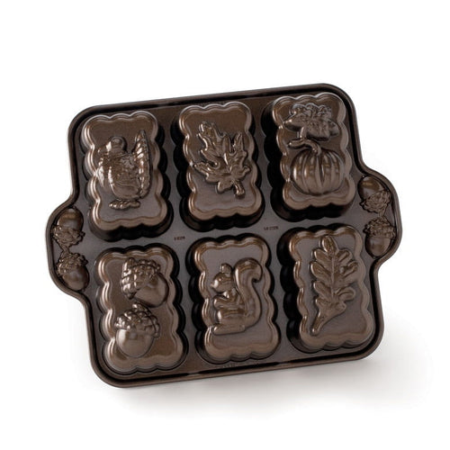 Nordic Ware harvest-themed mini loaf pan with six detailed cavity designs including turkey, leaf and pumpkin