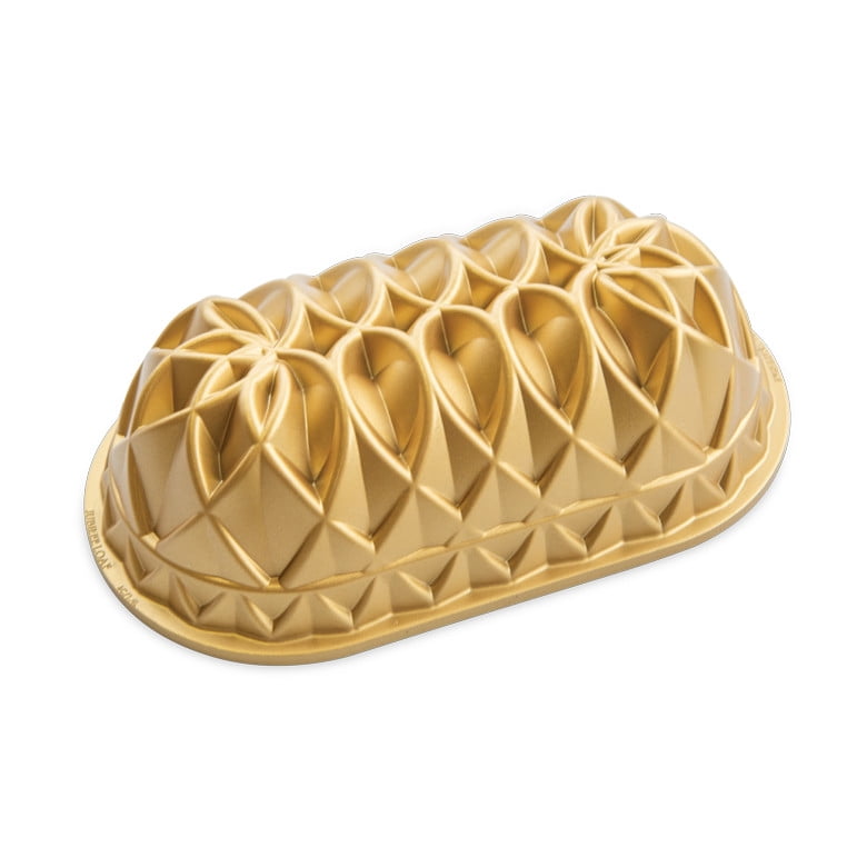 Nordic Ware gold-colored Jubilee loaf pan with geometric embossed decorative pattern, shown on white background.