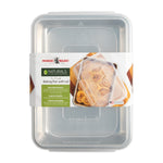 Packaged Nordic Ware Naturals aluminum baking pan with clear plastic lid and branded belly band showing product image and label