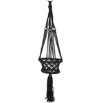Black macramé hanging planter with tassel and wooden beads on white background, full-length view