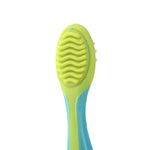 Rear view of a small silicone brush head showing wavy textured ridges on an oval green pad attached to a blue handle