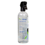 Nuvera microwave cleaner spray bottle showing left-side label text and clear liquid inside