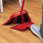O-Cedar broom being used with step-on dustpan on hardwood floor, foot on dustpan visible