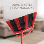 Red O-Cedar broom head showcasing dual black and red bristles against a softly blurred interior background