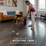 Person mopping a wood floor with an O-Cedar mop and bucket in a living room, lifestyle cleaning scene