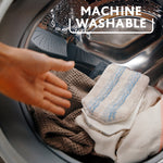 Microfiber mop pads inside a washing machine drum with hand reaching in, labeled machine washable