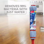 Packaged O-Cedar MicroTwist MAX mop shown upright with blurred wood floor background and cleaning claim