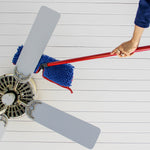 Person using O-Cedar mop with blue chenille head to dust a ceiling fan blade, shown from below