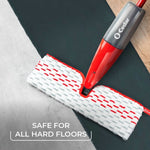 O-Cedar ProMist MAX mop head on a hard floor showing the refillable bottle and textured microfiber pad from above
