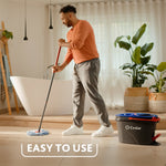 Lifestyle photo of person mopping a light tile floor with O-Cedar RinseClean bucket visible and caption easy to use