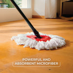 O-Cedar triangular red mop head with white microfiber refill on a hardwood floor, angled mop handle visible