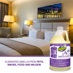 OdoBan Ready-to-Use Lavender Liquid Air Freshener jug shown in a hotel bedroom scene with product callout text.