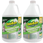 Two white one-gallon-style jugs of OdoBan Outdoor & Yard odor eliminator with green product labels