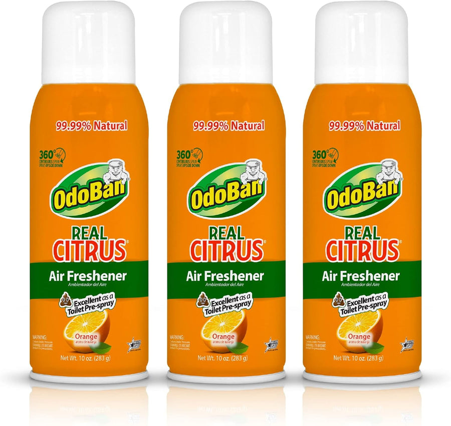 Three OdoBan Real Citrus orange aerosol air freshener cans with white caps on white background