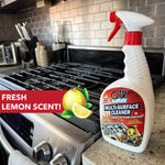 Oil Eater spray bottle placed on a kitchen counter next to a stovetop with 'fresh lemon scent' label graphic