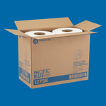 Open cardboard box stamped PACIFIC BLUE containing two large jumbo toilet paper rolls against blue background