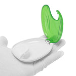 Open light green and white shell-shaped retainer case held on a gloved hand against white background
