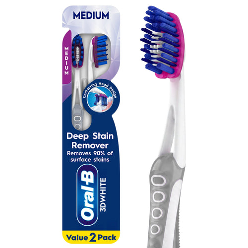 Oral-B 3D White manual toothbrushes in retail blister pack showing two medium brushes