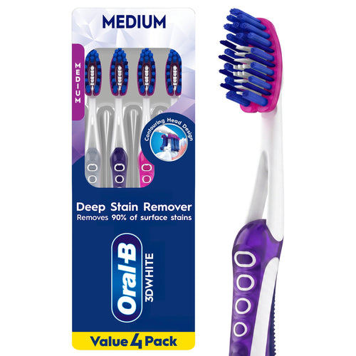 Oral-B 3D White medium toothbrushes in blister pack with purple and blue handles visible