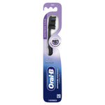 Full retail blister card packaging showing Oral-B advanced whitening charcoal toothbrush against purple-blue gradient backing