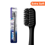 Oral‑B black extra‑soft Pro Whitening toothbrush shown in blister pack and close-up of black bristle head.