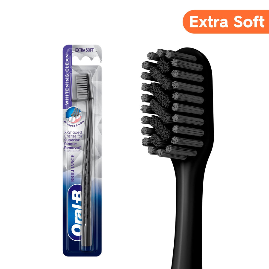 Oral‑B black extra‑soft Pro Whitening toothbrush shown in blister pack and close-up of black bristle head.