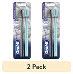Two Oral-B Brilliance extra soft manual toothbrushes in blister pack, one black and one teal handle, front packaging view.