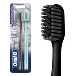 Oral-B blister pack with black and teal toothbrushes at left and a close-up render of the black toothbrush head at right.