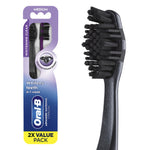 Oral‑B two‑pack charcoal advanced whitening toothbrush package with close-up of black toothbrush head on white background.