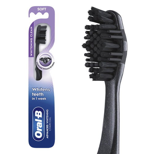 Oral-B charcoal-infused soft toothbrush in retail blister card with purple-blue whitening clean design