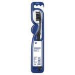 Rear view of Oral-B blister pack showing the black charcoal toothbrush in clear plastic with barcode and product information