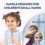 Lifestyle-style image of a child holding a purple toothbrush beside a Frozen II character panel and handle-features text