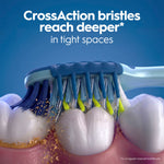 Illustration of CrossAction toothbrush bristles cleaning between molars, showing bristles reaching into tight spaces