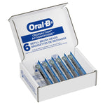 Open box of Oral‑B CrossAction refill brush heads showing six individually sealed replacement heads inside.