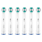 Row of six assembled Oral‑B round brush heads with green and white bristles on a white background.