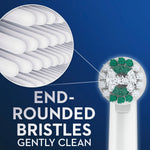 Close-up illustration of round toothbrush head bristles with a magnified view highlighting end-rounded bristles on a blue background.