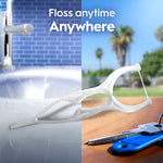 Lifestyle-style image of a white floss pick placed over a split background showing a sink and outdoor scene with keys