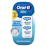Oral-B Glide Healthy Gums unflavored floss two-pack blister card showing two white floss containers and micro-textured badge